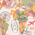 Opened passport with visas, stamps, seals, world map. (travel, tourism)