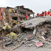 VAN, TURKEY - OCTOBER 25: A building and car ruined during the earthquake of Van-Ercis on October 25, 2011 in Van, Turkey. It is 604 killed and 4152 injured in Van-Ercis Earthquake.