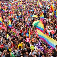 People in Taksim Square for LGBT pride parade on June 30, 2013 in Istanbul, Turkey. Almost 100.000 people attracted to pride parade and the biggest pride ever held in Turkey.