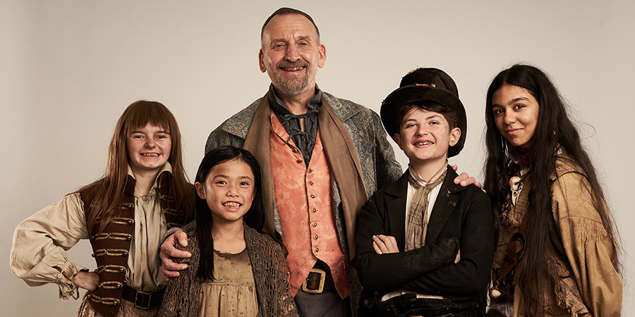 Dodger. Image shows from L to R: Polly (Ellie-May Sheridan), Tang (Mila Lieu), Fagin (Christopher Eccleston), Dodger (Billy Jenkins), Charley Bates (Aabay Ali)