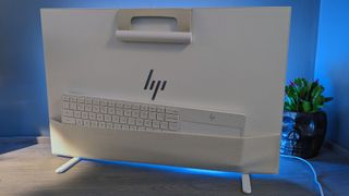 Backside of the HP Envy Move and it's pocket storage area which is holding the keyboard.