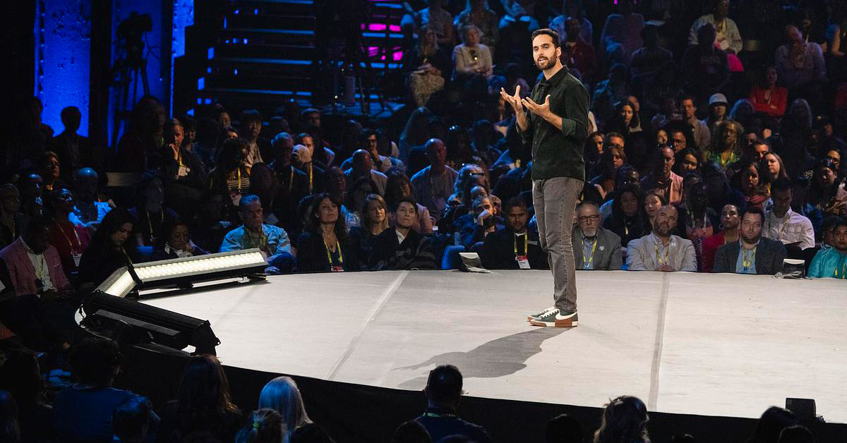 Simone Stolzoff speaks on stage at TEDNext