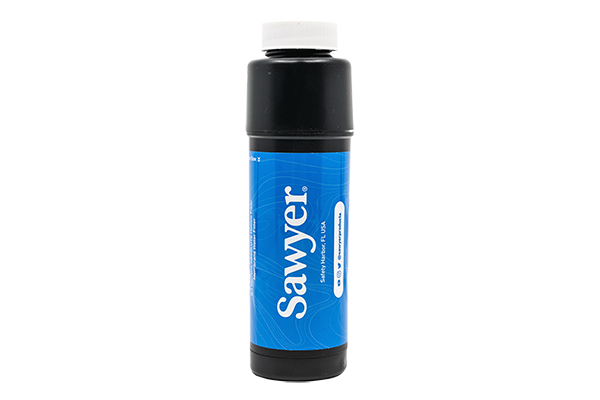 A Sawyer tap filter with blue label, black body and a white cap