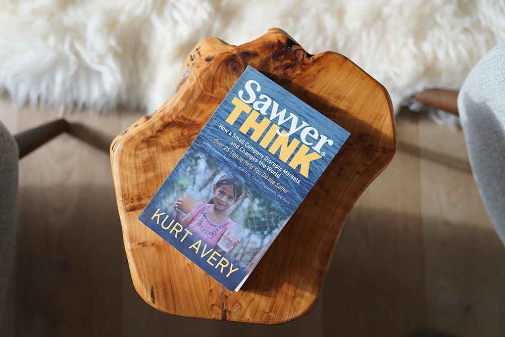 A book titled Sawyer Think by Kurt Avery sitting on an end table