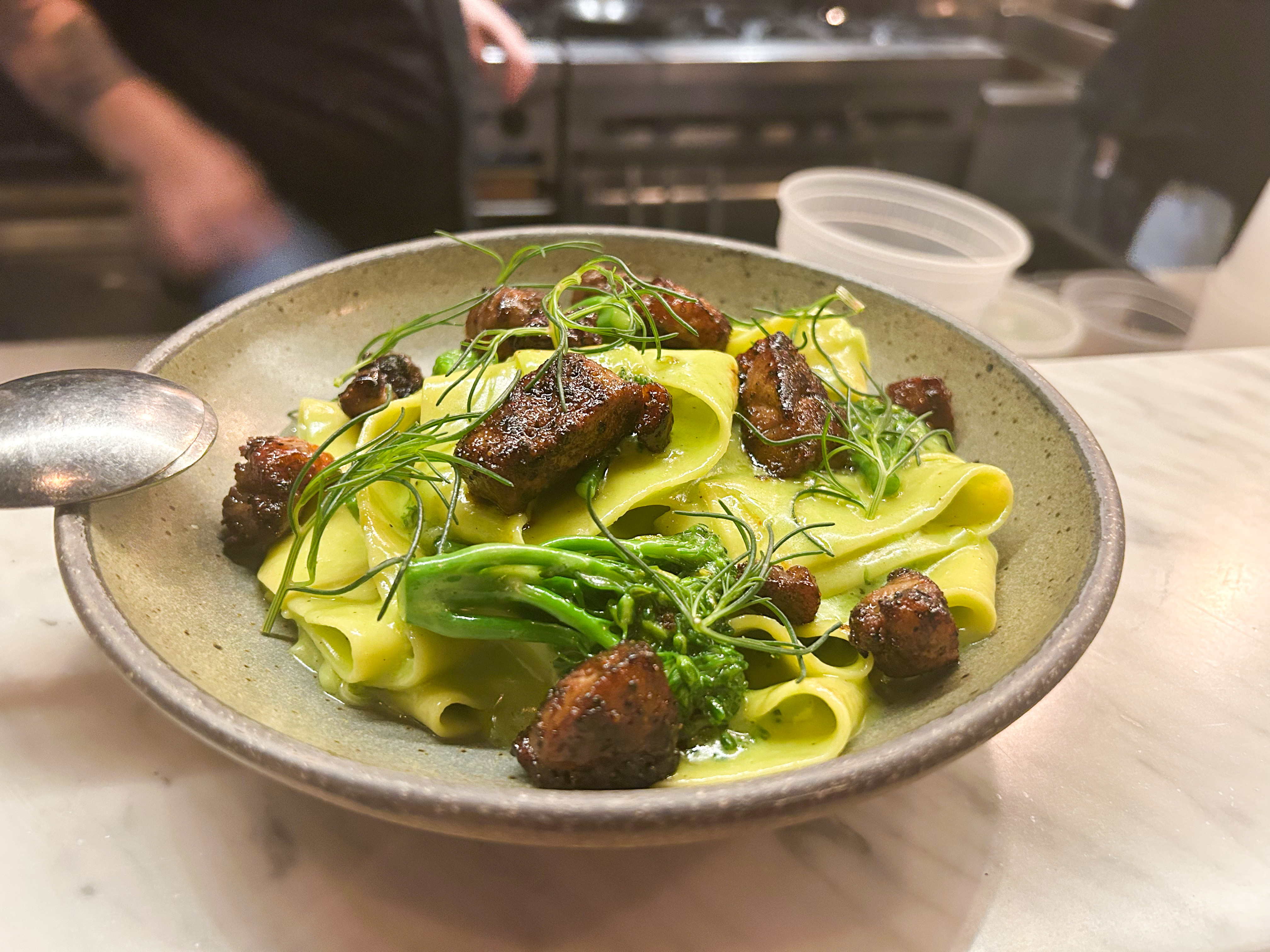 A bowl of pasta sits on the bar at Scotch Lodge.