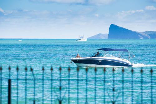 a boat in the middle of the water at Garden Villas in Grand-Baie