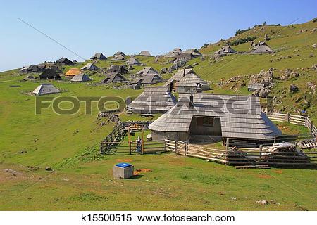 Stock Image of Wooden alpine huts.