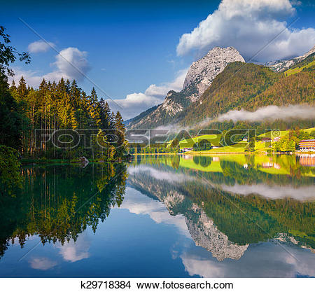 Stock Photo of Misty summer morning on the Hintersee lake in.