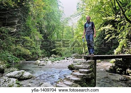 Stock Photo of Male hiker at Kozjak brook, Kobarid, Slovenia.