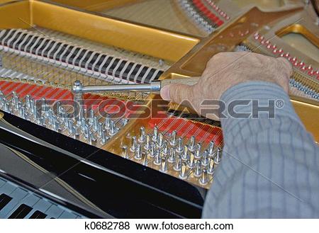 Pictures of tuning piano strings k0682788.