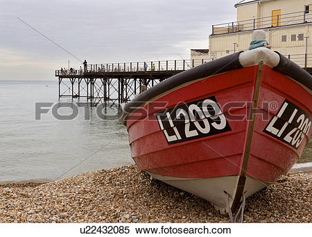 Stock Image of Fishing off the pier in Bognor Regis West Sussex.