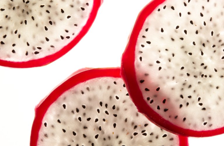 Raw sliced seeded vegetable on bright white background