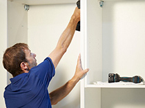 California Closets Installing White Shelving