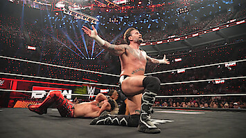 Seth Rollins and CM Punk in the ring.