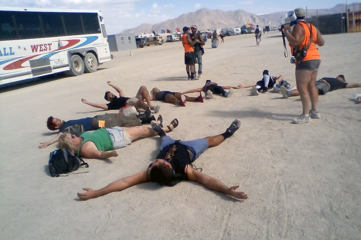 Making dust angels at Burning Man 2019