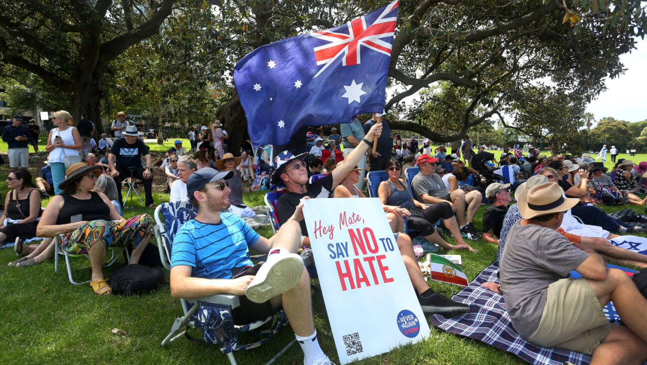 Protesters hold placards and flags during a rally against antisemitism at The Domain in Sydney, Australia, on Feb. 18, 2024. (Lisa Maree Williams/Getty Images)