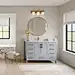 Bathroom - transitional light wood floor, beige floor and single-sink bathroom idea with shaker cabinets, gray cabinets, beige walls, an undermount sink, quartz countertops, white countertops and a freestanding vanity