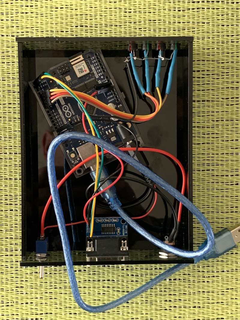The inside of a fMODEM, showing the Arduino UNO Wifi Rev 2, and a TTL RS232 card
