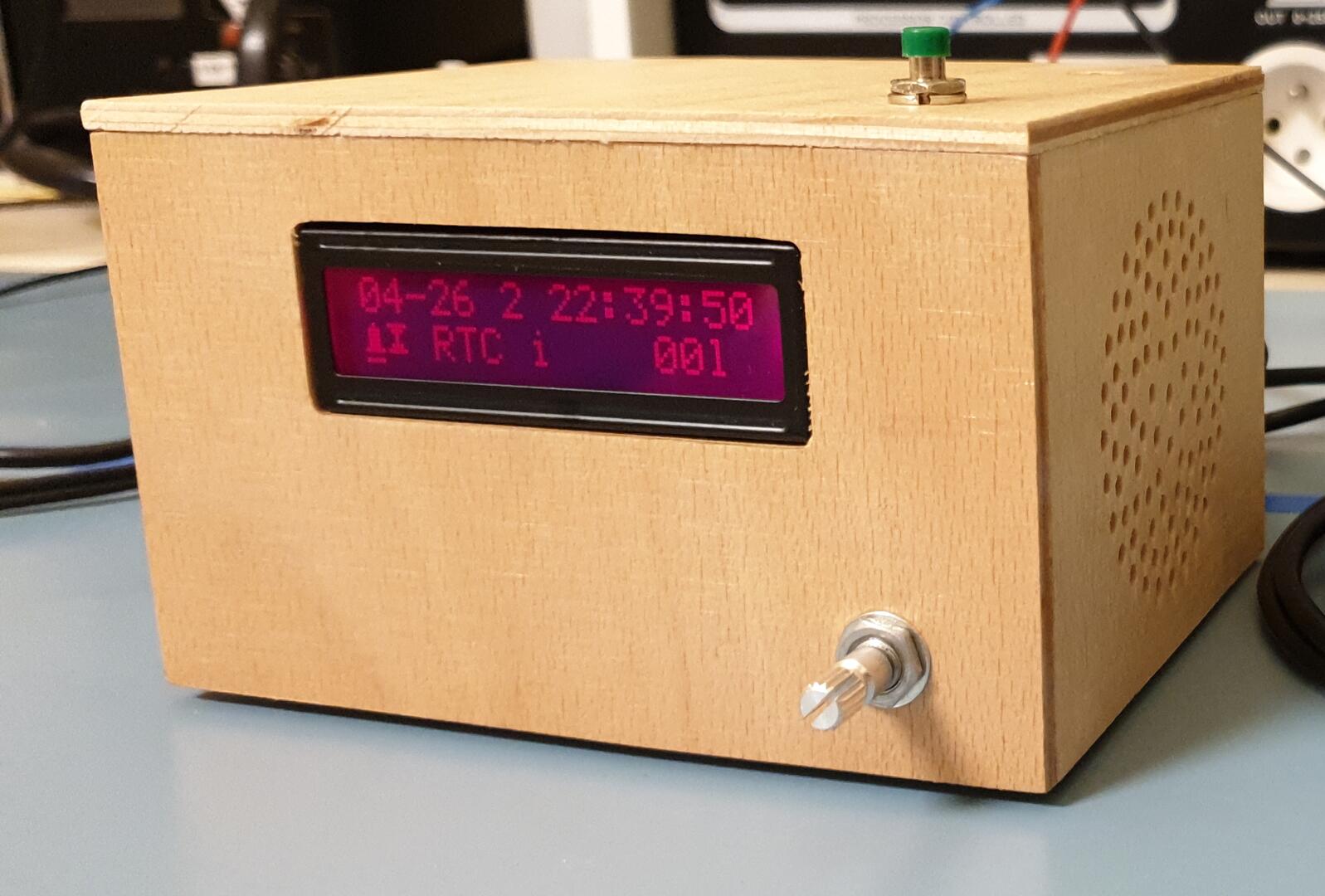 Front side of AlarmClock in a wooden enclosure