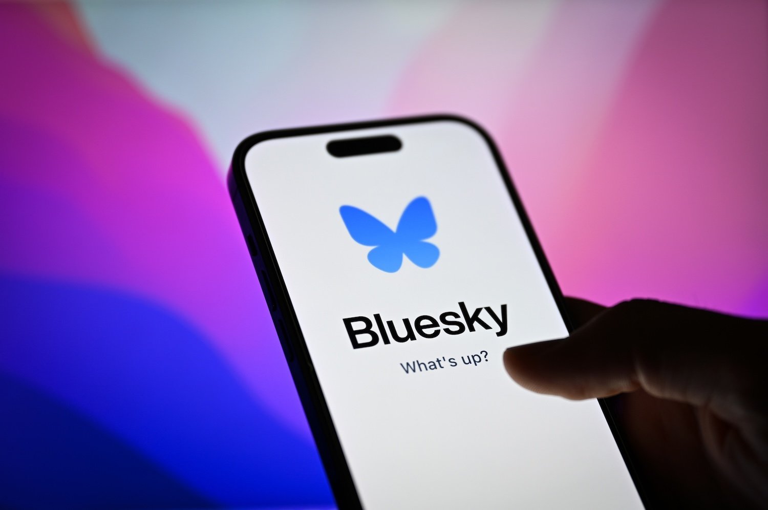 In this photo illustration, the logo of Bluesky is displayed on a mobile phone screen in front of a computer screen in Ankara, Turkiye on Septemer 04, 2024.