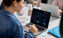 woman using laptop to view data