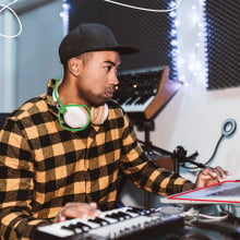 Man DJing on Lenovo laptop