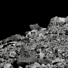 NASA spacecraft observing asteroid Bennu rocks