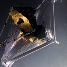 An artist's illustration of the James Webb Space Telescope observing the cosmos 1 million miles from Earth.