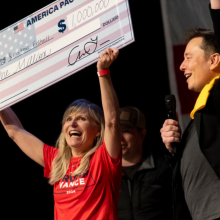 SpaceX and Tesla founder Elon Musk awarded Kristine Fishell with a $1 million check during the town hall at the Roxain Theater on October 20, 2024 in Pittsburgh, Pennsylvania.