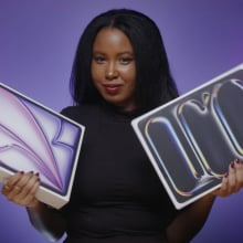 woman holding the ipad pro and ipad air in either hand