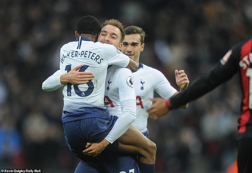 Kyle Walker-Peters celebrates with Christian Eriksen after Tottenham opened the scoring in the 16th minute