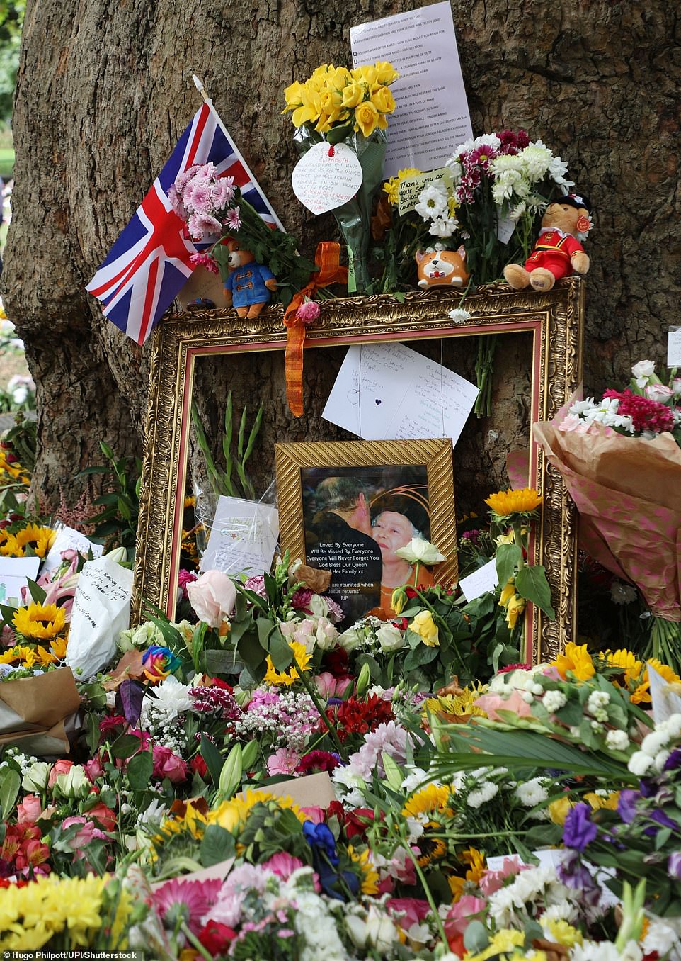 Members of the public lay flowers and other tributes for the Queen in Green Park on Monday, September 12