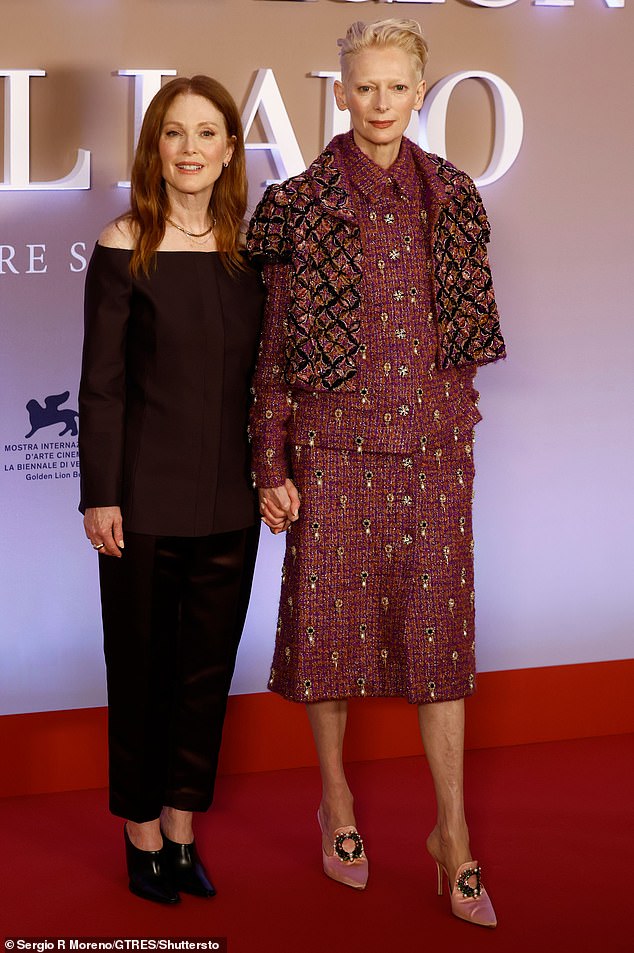 Julianne Moore looked effortlessly chic as she held hands with quirky-dressed co-star Tilda Swinton at The Room Next Door photocall in Madrid on Wednesday