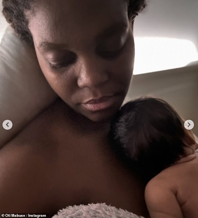 In one snap, Oti had her eyes closed as her daughter rested on her chest