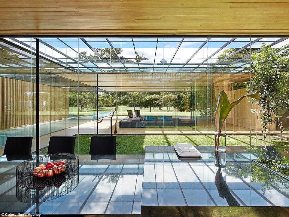 The property has an open plan design with glass panels creating a light and airy feel throughout the home 