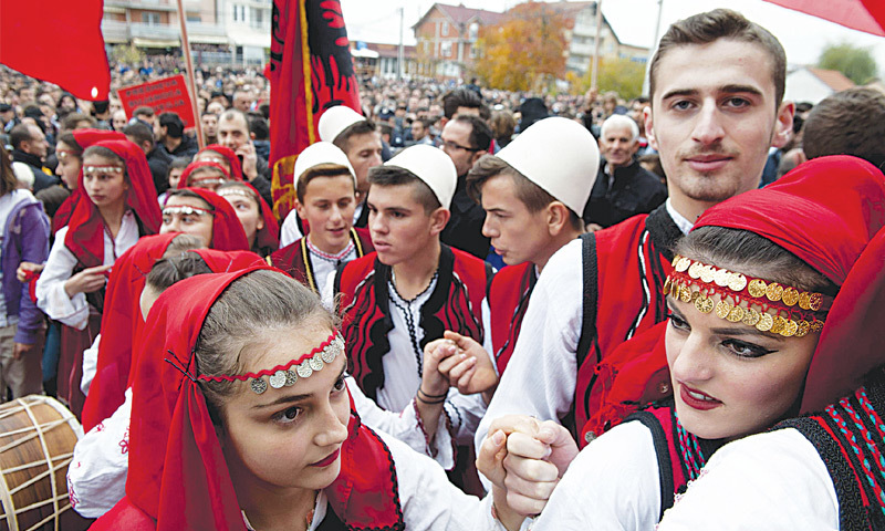 PRESEVO: People wearing traditional outfits await the arrival of the Albanian prime minister in this Serbian town on Tuesday.—AFP