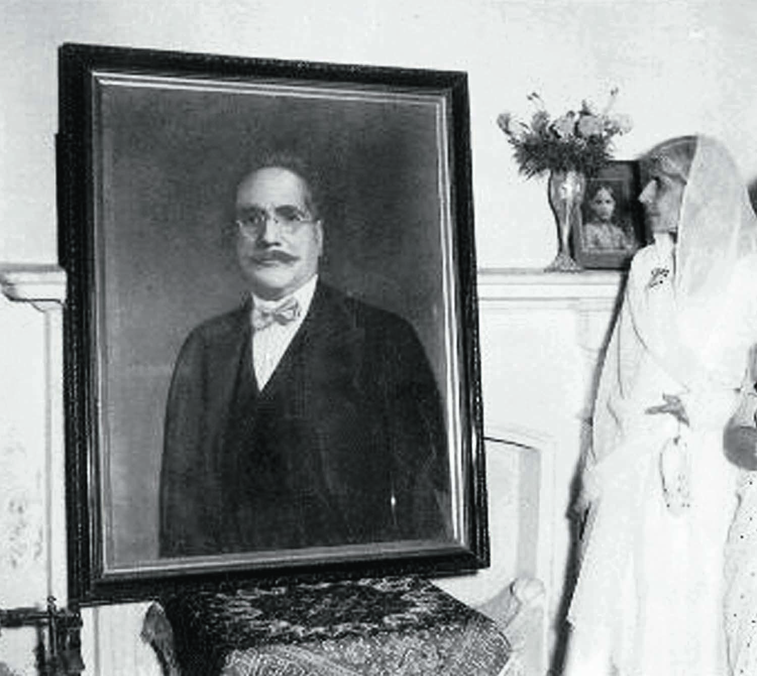 MISS Fatima Jinnah looks at a portrait of Allama Iqbal during a visit to his home in Lahore in the 1960s. | Photos: The Allama Iqbal Collection.