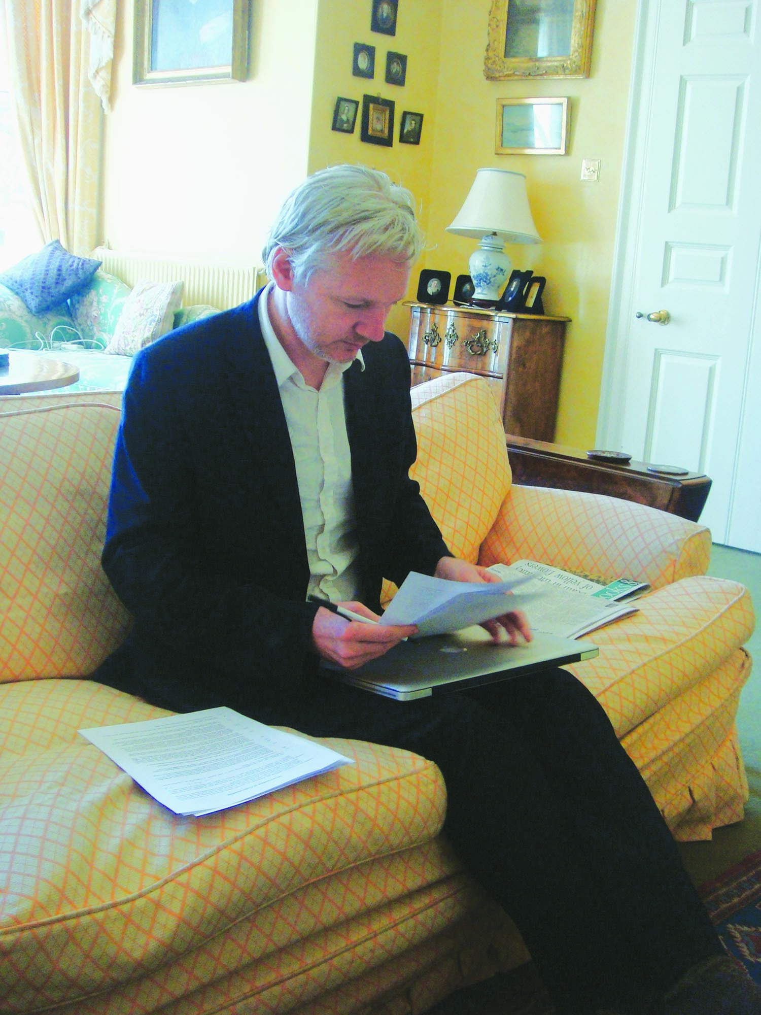 Julian Assange of the Wikileaks at his refuge in a London suburb in 2011 reviewing the draft agreement that he subsequently signed with Dawn, allowing it exclusive right to carry the content in Pakistan.