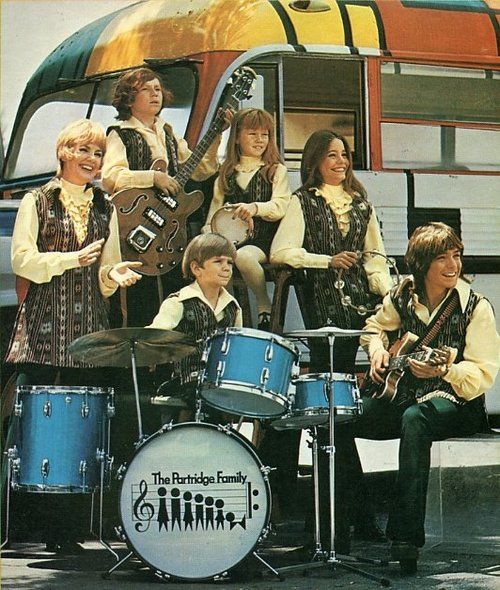 the partridge family posing with their instruments and drums in front ...