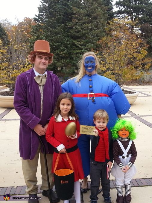 the family is dressed up in costumes for halloween