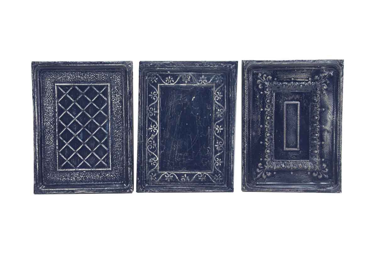 Navy blue and white decorative tin panels with three different designs ...