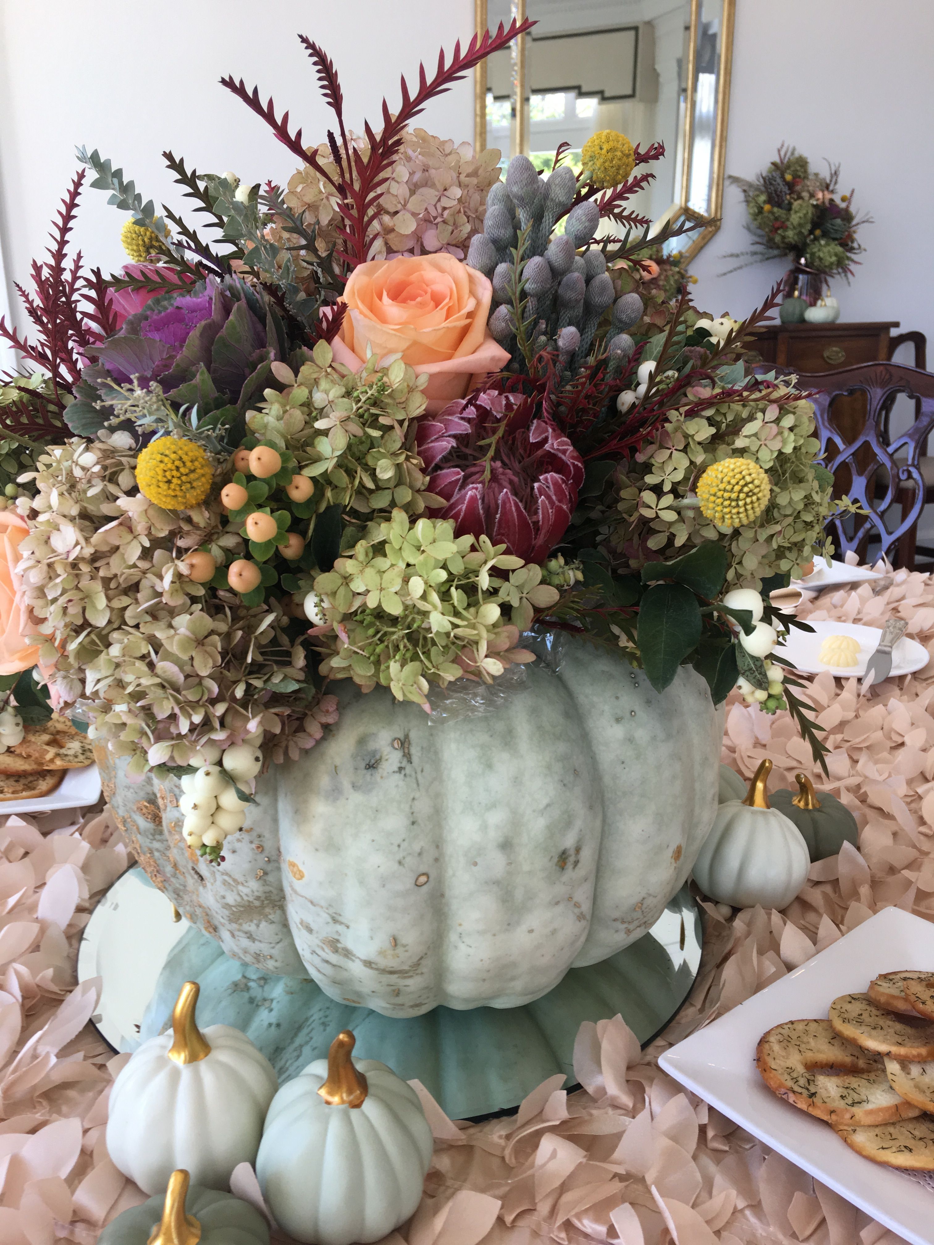 Pumpkin fresh flower centerpiece Flower centerpieces, Fall wedding, Table decorations