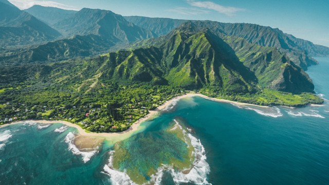 Hawaii English represented by the coast of Hawaii shot from a helicopter.