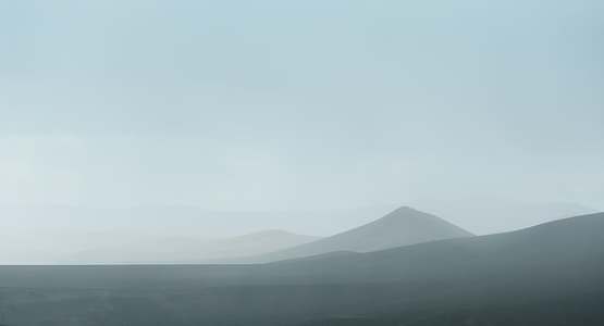 photo of mountains during day time