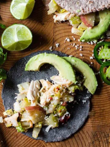 Rick Bayless rotisserie chicken tacos on homemade tortillas.