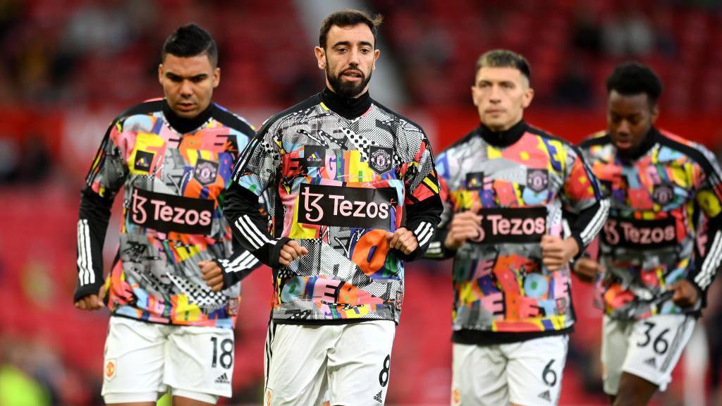 Bruno Fernandes and team-mates warm up in a rainbow-themed top before a Premier League match against West Ham on October 30, 2022