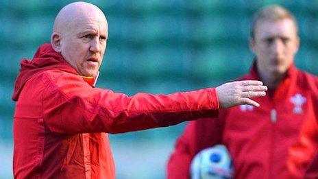 Shaun Edwards issues instructions during a Wales training session, watched by Neil Jenkins