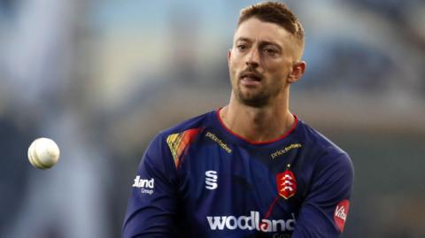 Daniel Sams catches the white ball during a T20 Blast game for Essex