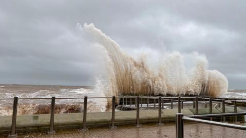 Waves crash high into the seafront in Devon during Storm Bert