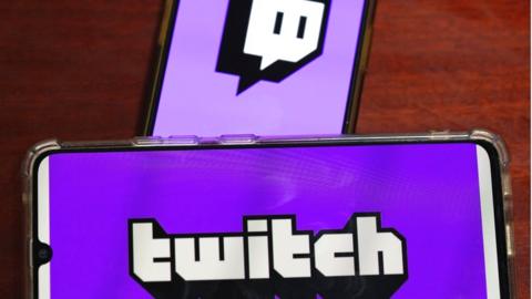 The Twitch logo on a phone screen